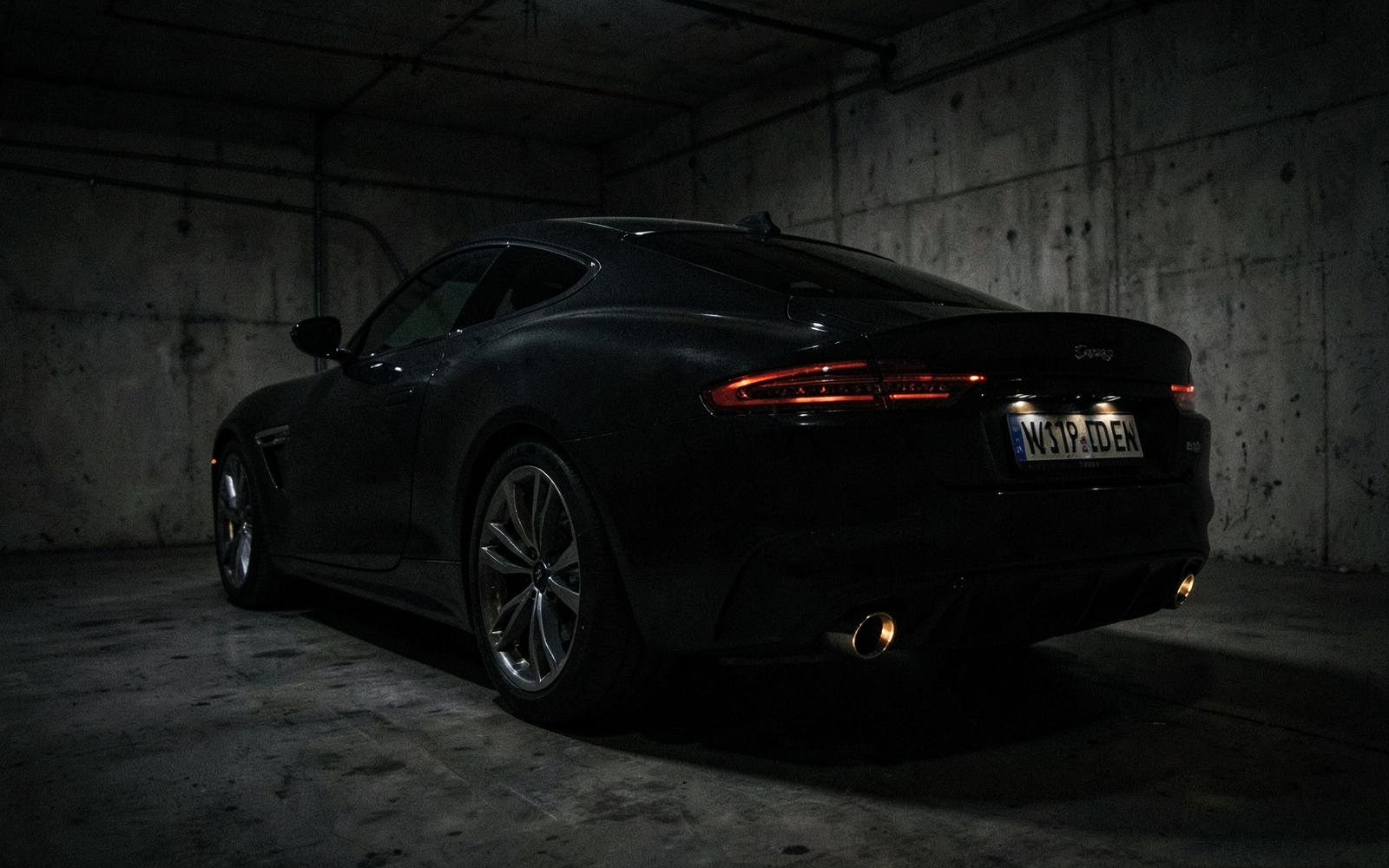 Aston Martin DB11 in a dimly lit garage